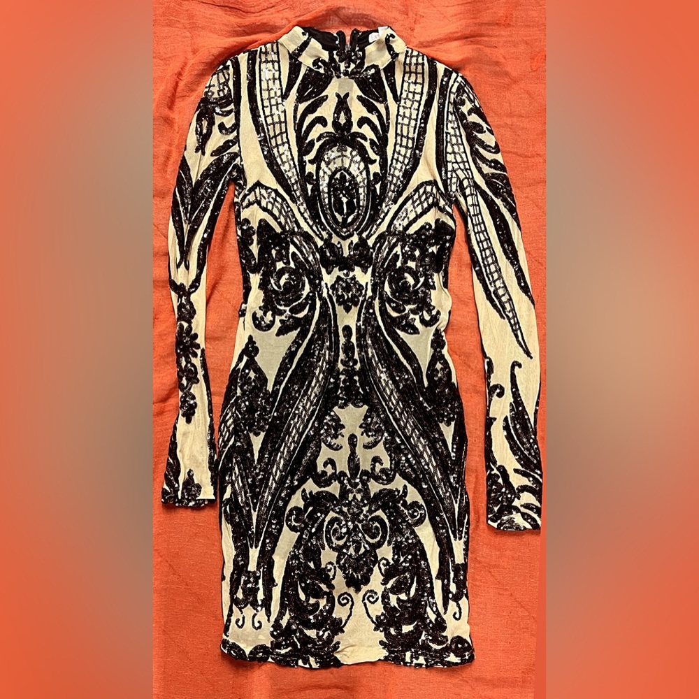 Embroidered Black and Cream Patterned sheer dress with build in shorts.